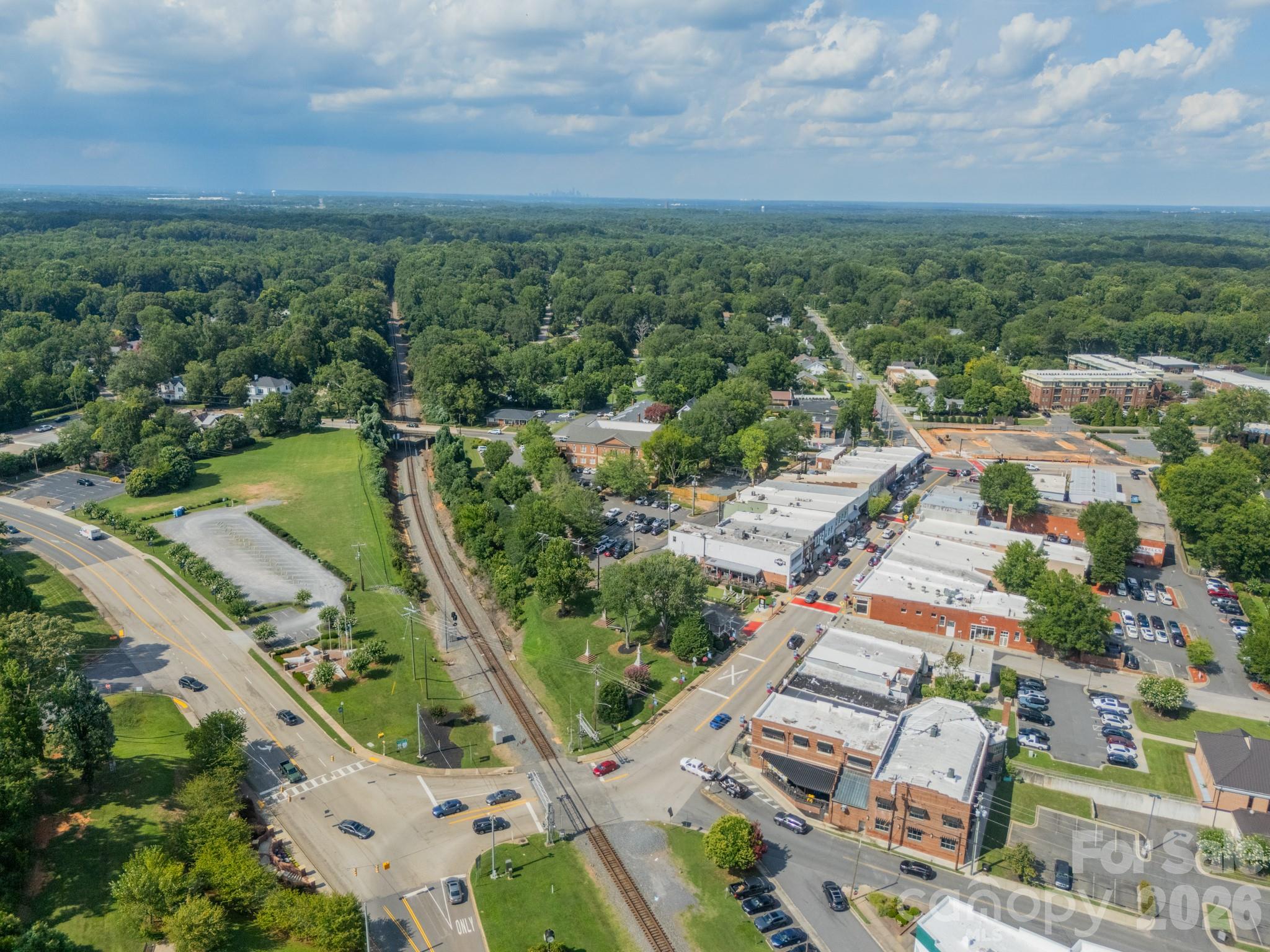 204 West Elliott Street Fort Mill, SC 29715 - Photo 40 of 43 an aerial view of residential houses with outdoor space