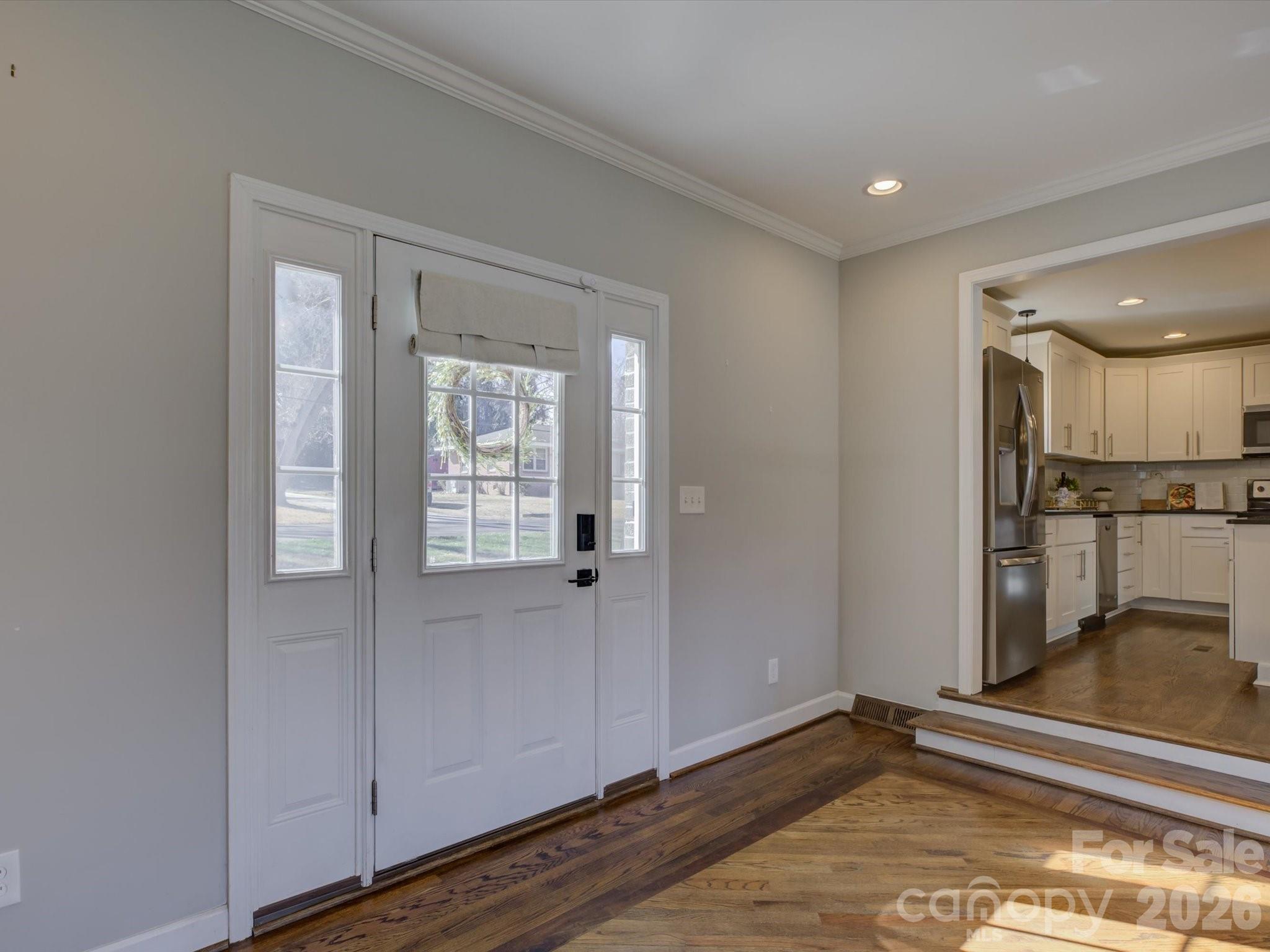 204 West Elliott Street Fort Mill, SC 29715 - Photo 5 of 43 a view of empty room with wooden floor and cabinet