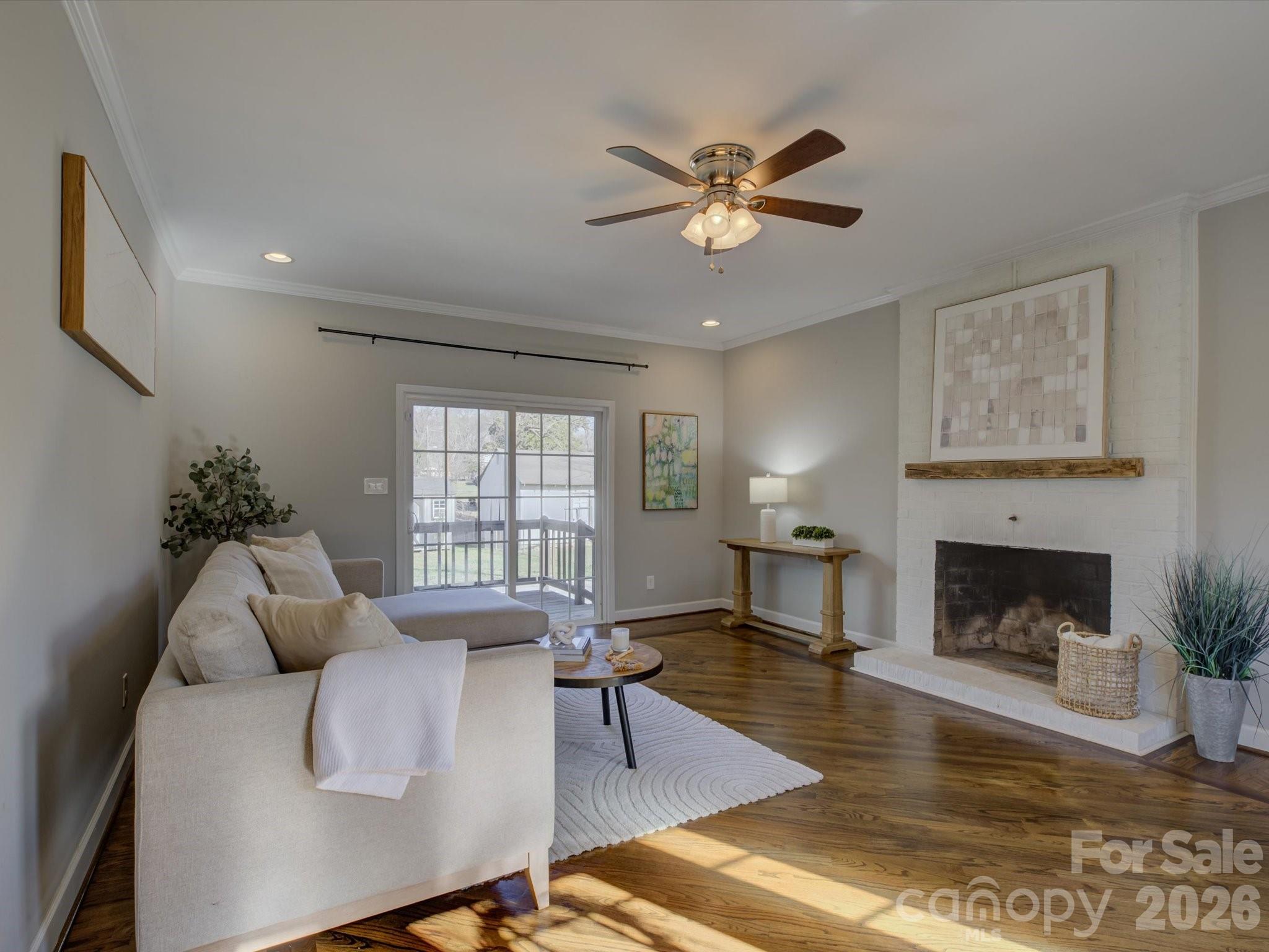204 West Elliott Street Fort Mill, SC 29715 - Photo 6 of 43 a living room with furniture and a fireplace
