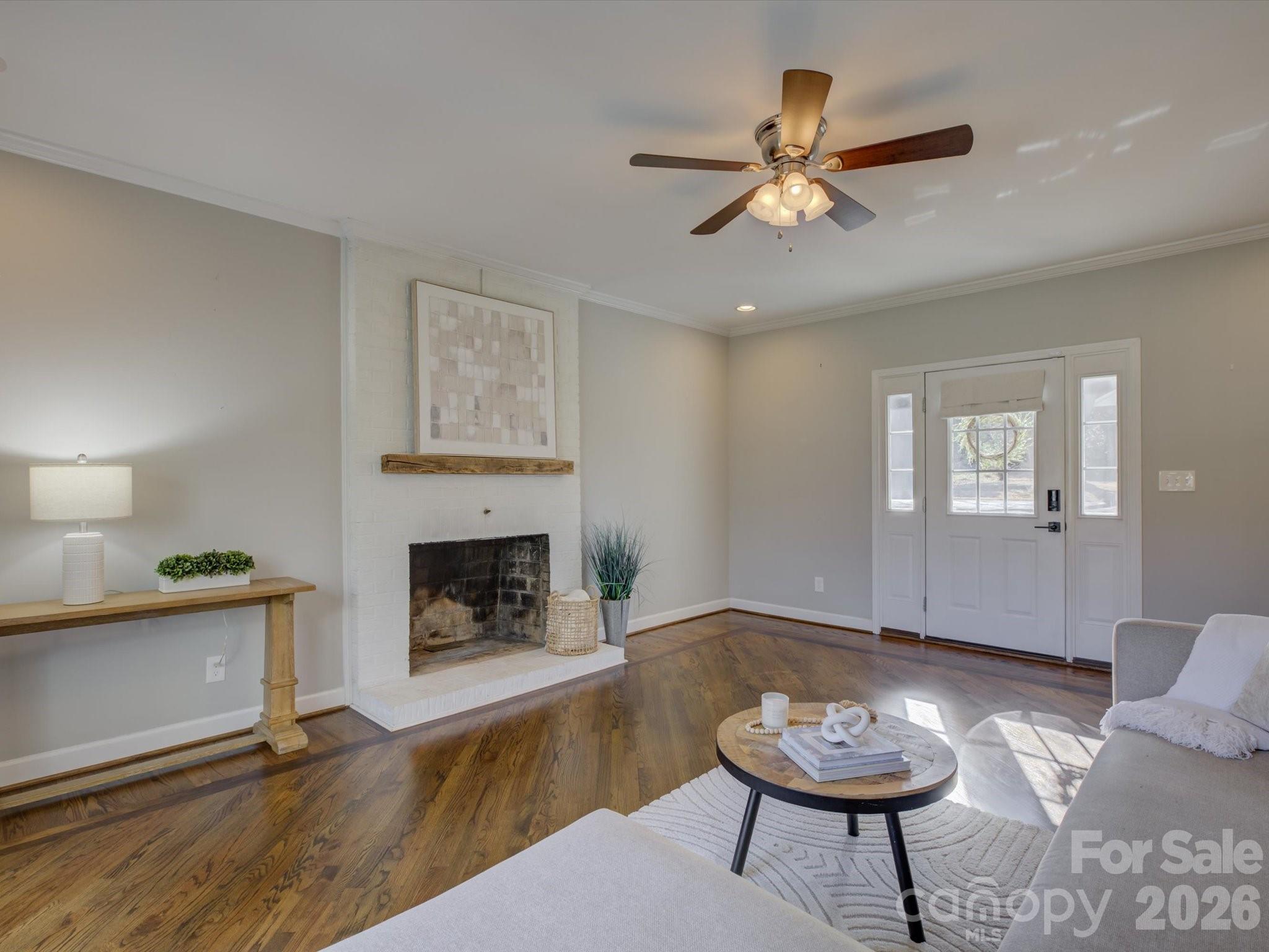 204 West Elliott Street Fort Mill, SC 29715 - Photo 9 of 43 a living room with furniture and a fireplace
