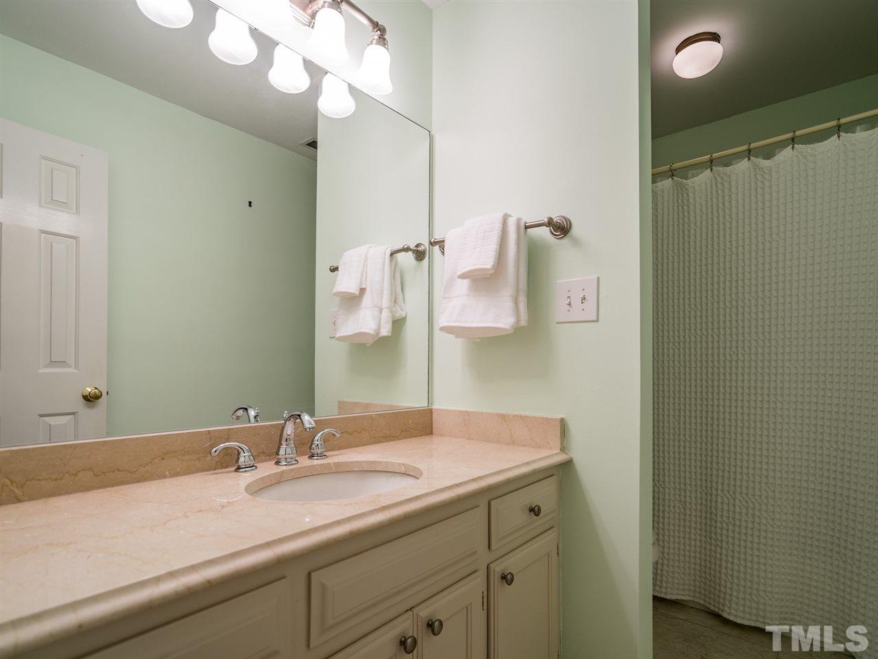 8508 Council Court Raleigh, NC 27615 - Photo 20 of 27 The hall bath has a tub/shower combination as well.