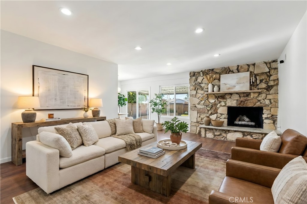 7425 Garden Grove Avenue Reseda, CA 91335 - Photo 1 of 12 a living room with furniture and a fireplace