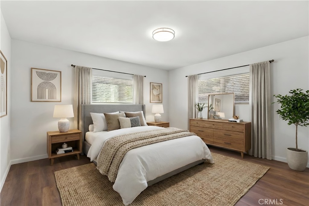 7425 Garden Grove Avenue Reseda, CA 91335 - Photo 4 of 12 a bedroom with a large bed and a window