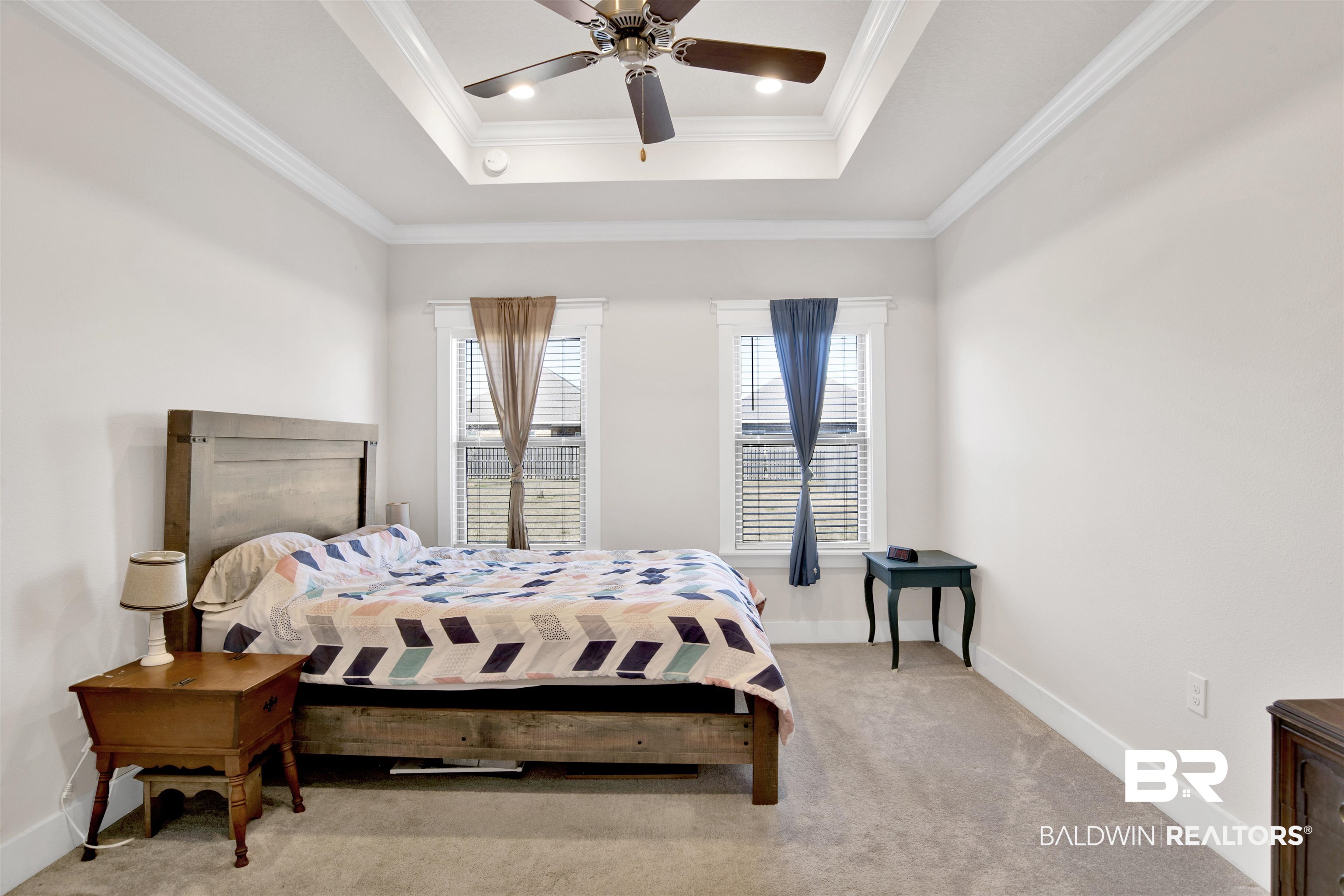 1174 Pheasant Circle Foley, AL 36535 - Photo 19 of 29 Bedroom with a raised ceiling, light carpet, ceiling fan, and crown molding