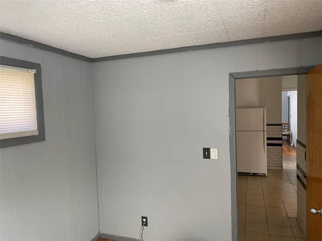 a view of a kitchen from the hallway