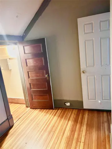 a view of entryway with wooden floor