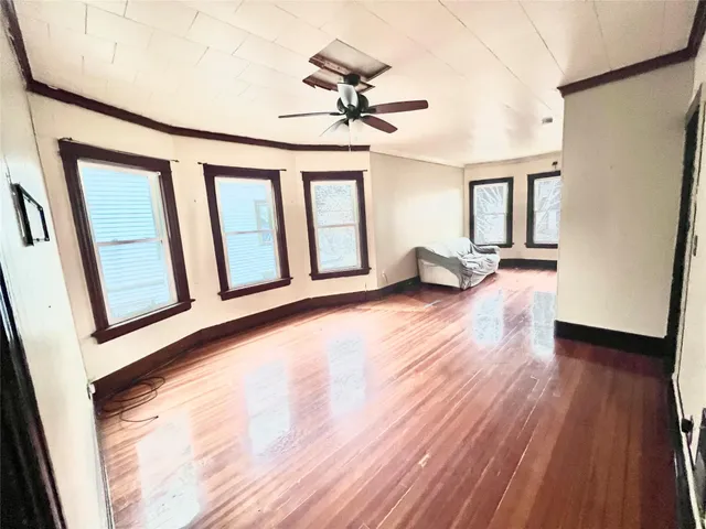 workspace with wooden floor and windows