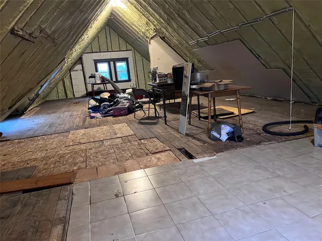 a living room with furniture a table and chairs