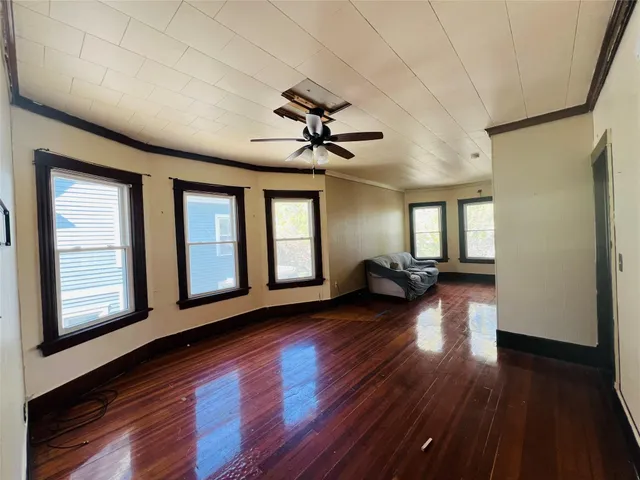 a view of livingroom with hardwood floor and a ceiling fan