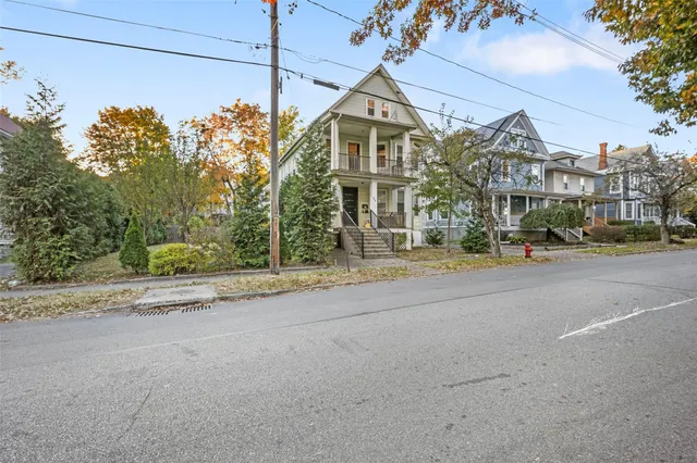 a view of a building with a street