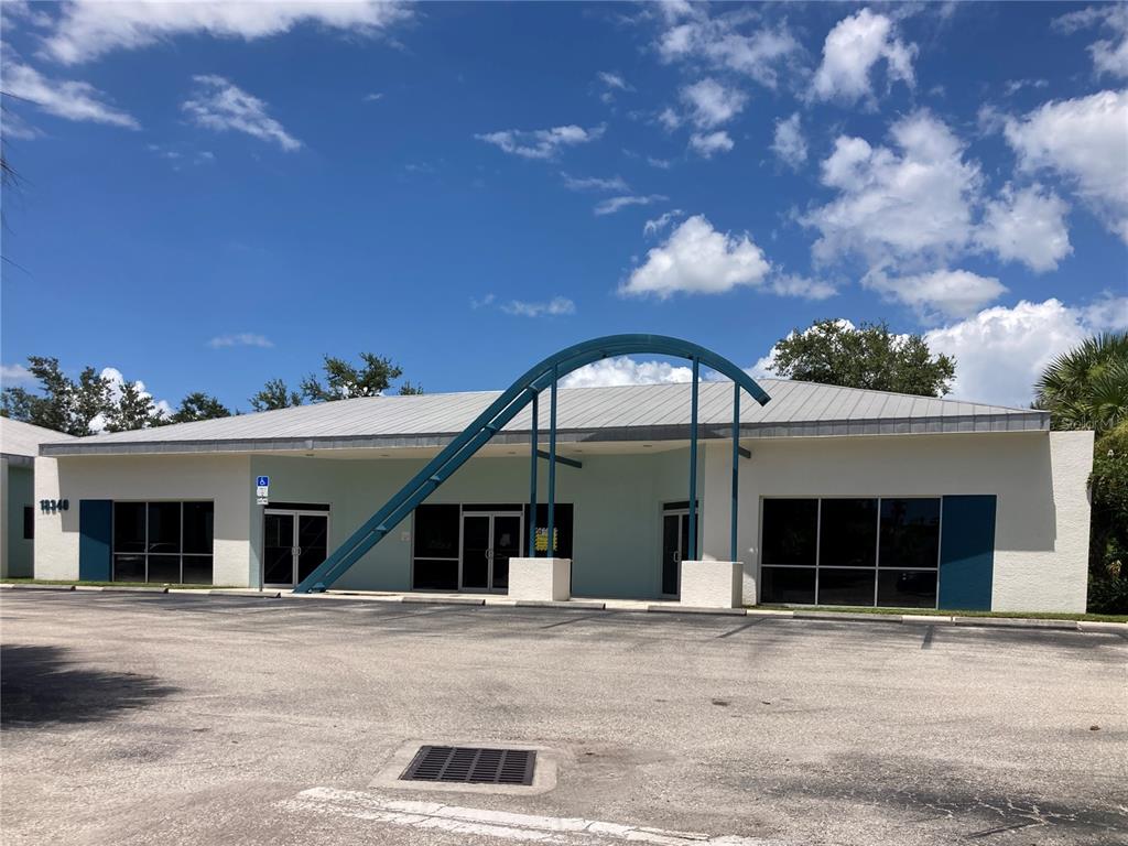 18340 Murdock Circle Port Charlotte, FL 33948 - Photo 5 of 9 front view of a house with a space