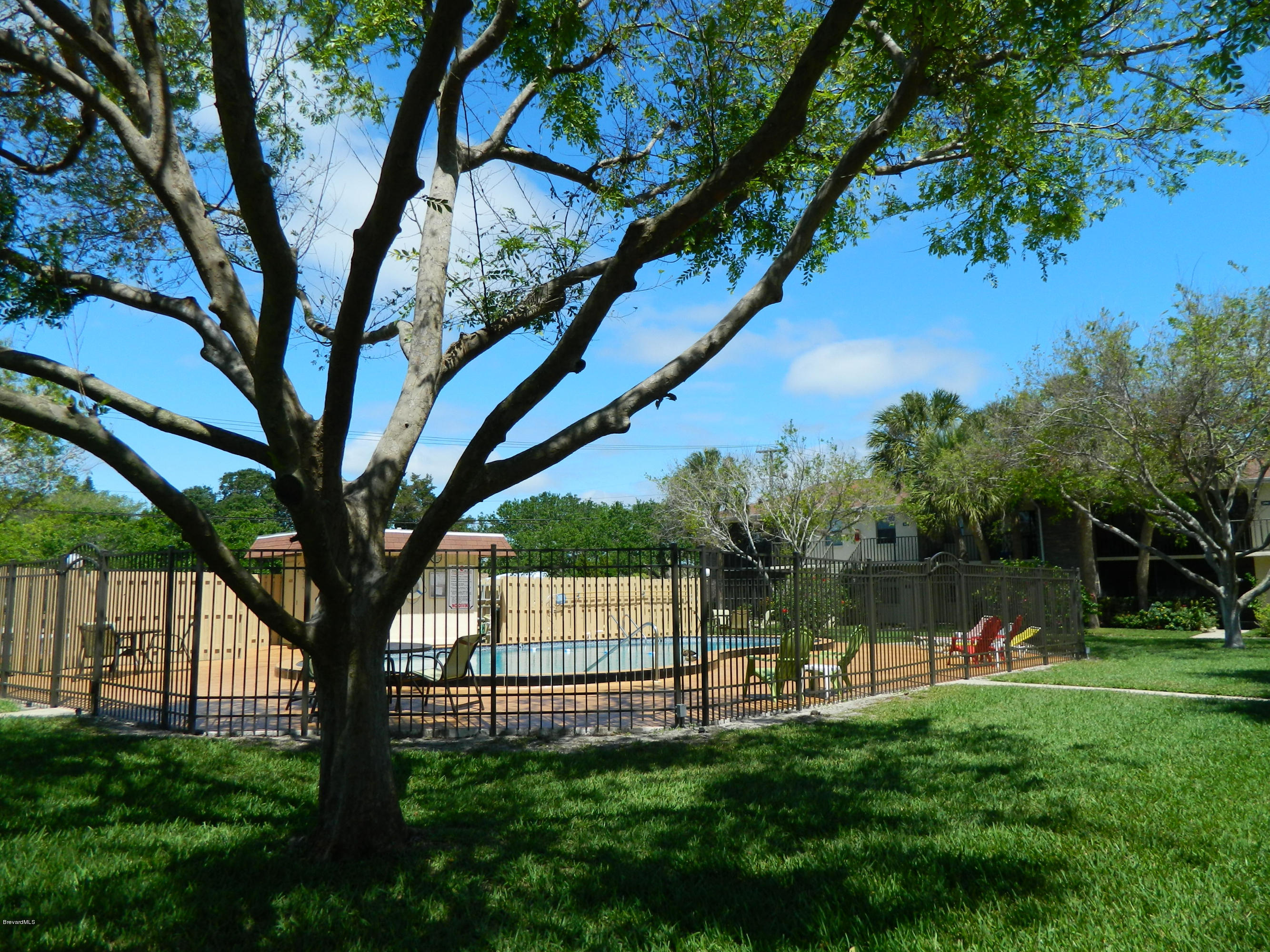 500 Catalina Road, Unit 404 Cocoa Beach, FL 32931 - Photo 20 of 26 pool at distance