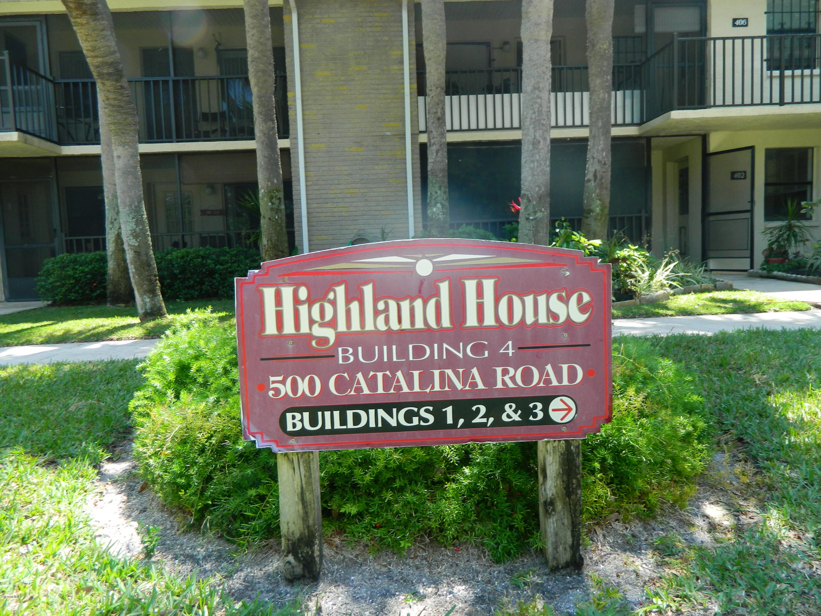 500 Catalina Road, Unit 404 Cocoa Beach, FL 32931 - Photo 23 of 26 bldg sign