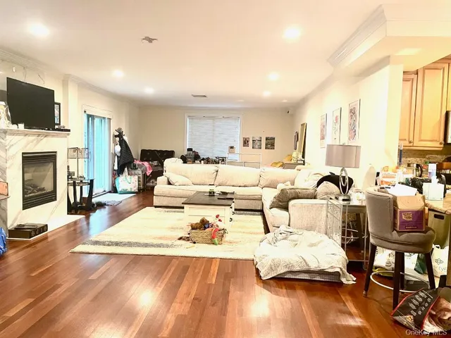 a living room with furniture fireplace and flat screen tv