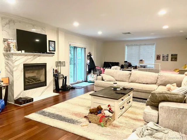 a view of a chairs and table in backyard