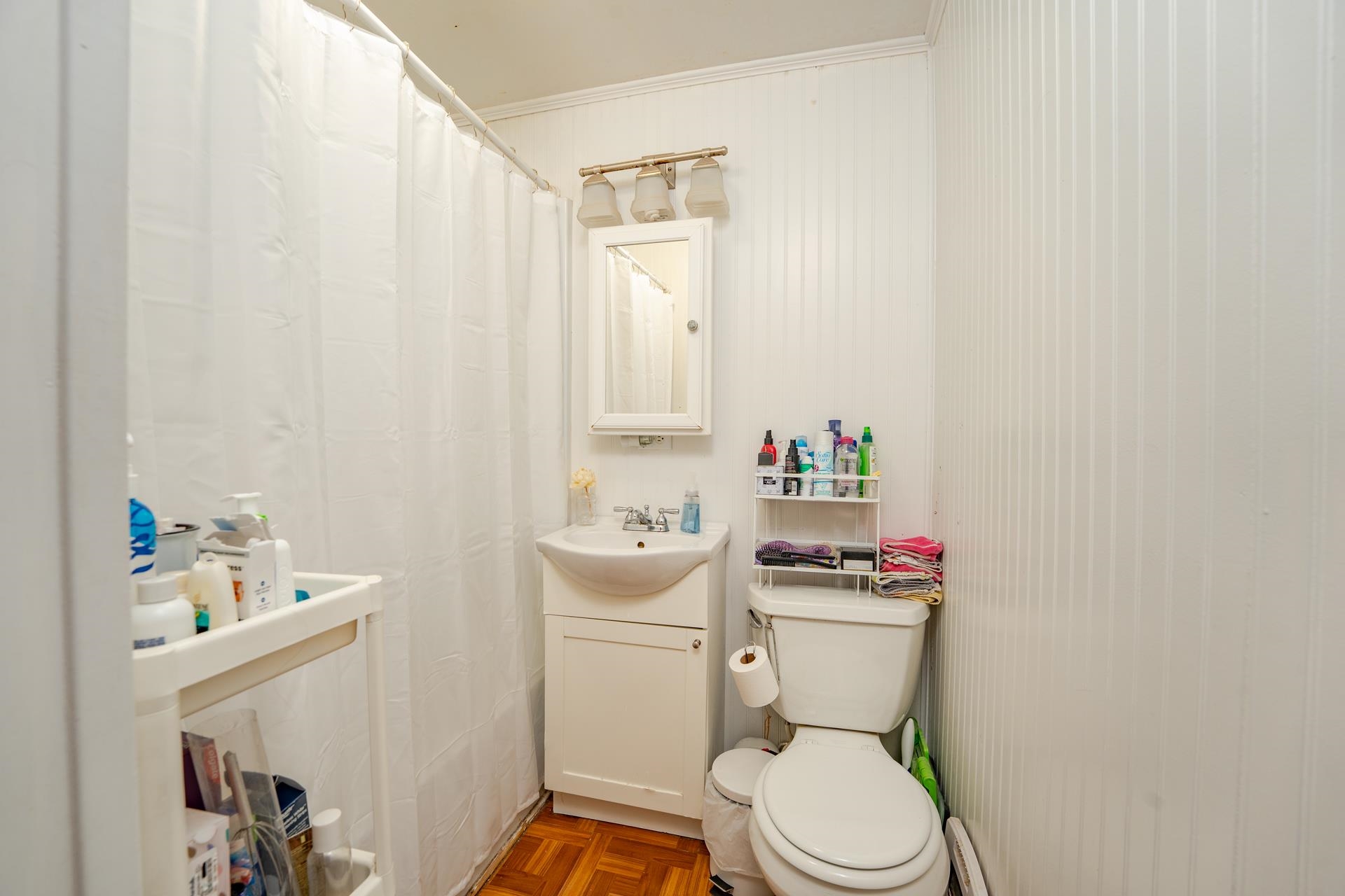 32 Norwood Road Marmora, NJ 08223 - Photo 18 of 32 a white toilet sitting next to a bathroom sink