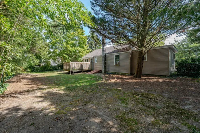 a view of a yard with a tree