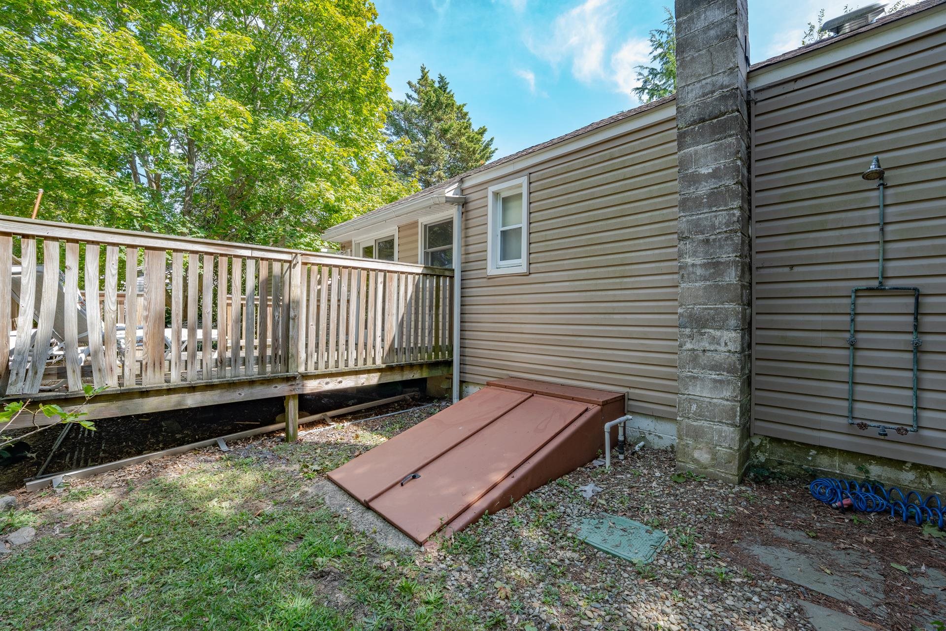 32 Norwood Road Marmora, NJ 08223 - Photo 27 of 32 a view of a backyard with a wooden fence