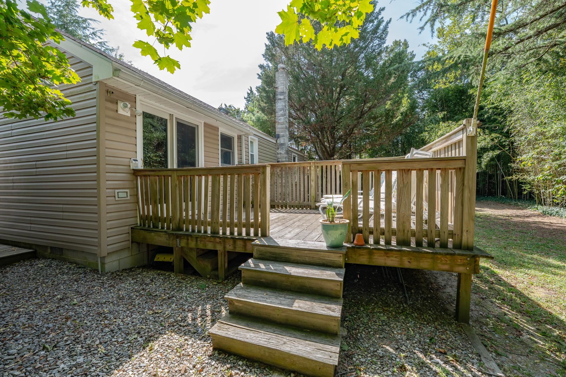 32 Norwood Road Marmora, NJ 08223 - Photo 28 of 32 a view of a chairs setting in the backyard
