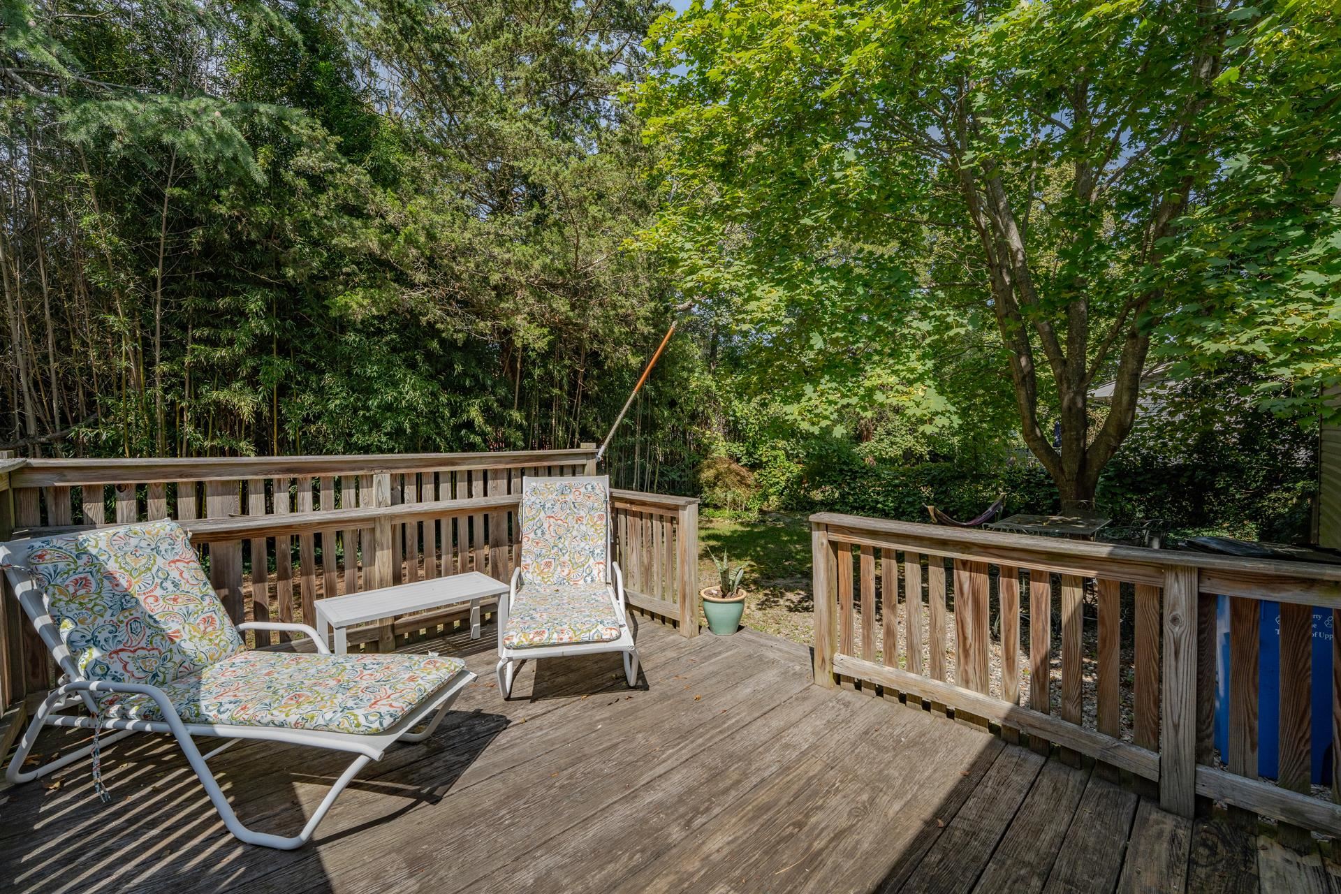 32 Norwood Road Marmora, NJ 08223 - Photo 30 of 32 a view of a deck with two chairs and wooden floor