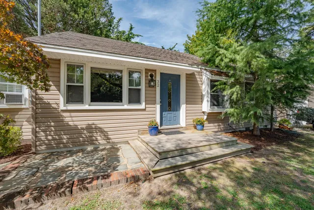 a house with yard in front of it