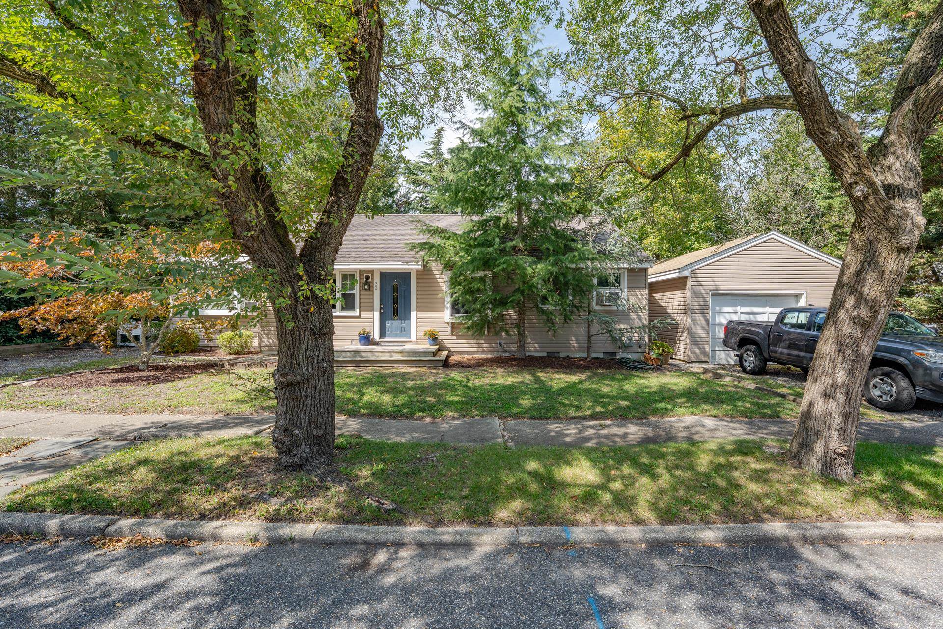 32 Norwood Road Marmora, NJ 08223 - Photo 6 of 32 a front view of a house with garden