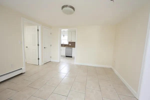 a view of a room with cabinet flat screen tv and windows