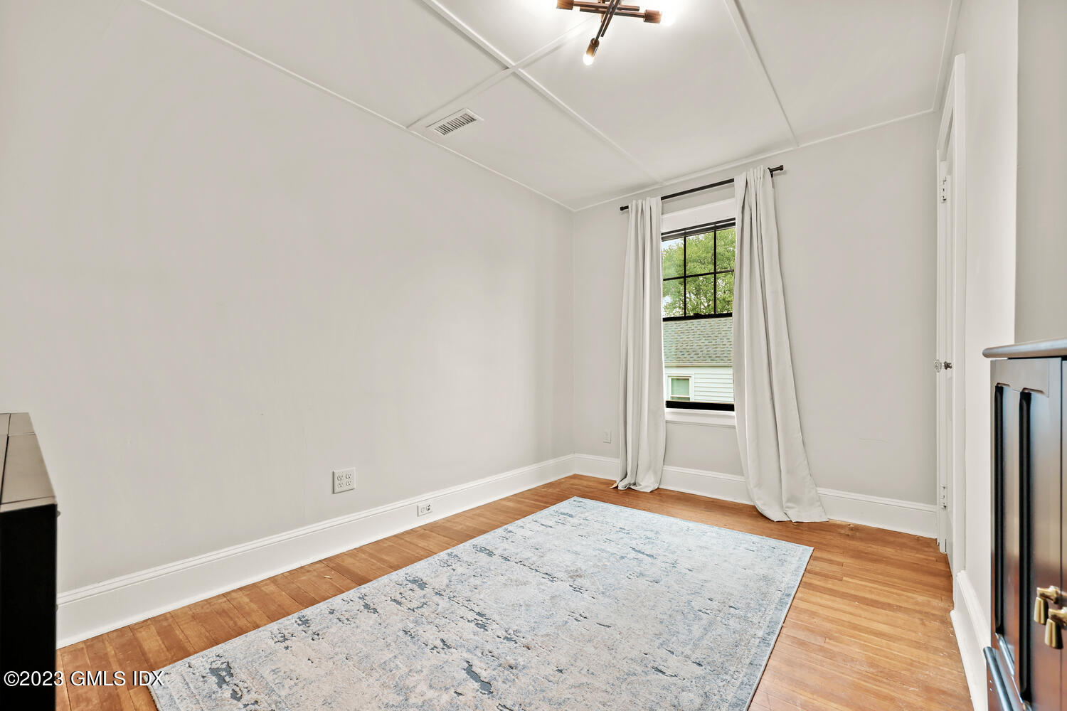 36 Ralph Street Stamford, CT 06902 - Photo 11 of 20 a view of empty room with wooden floor