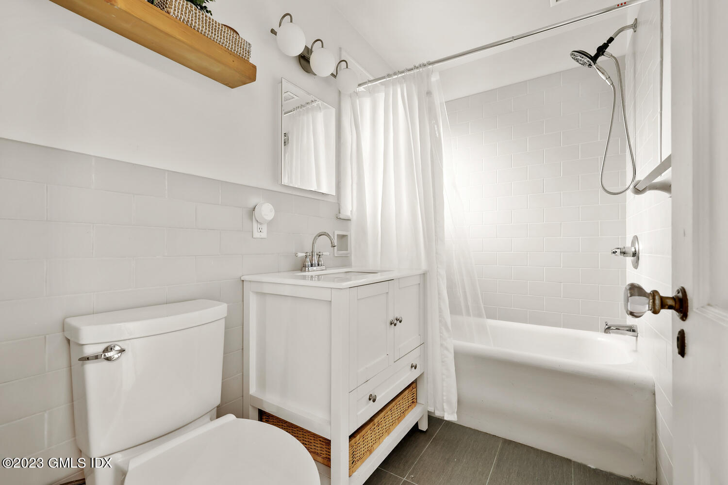 36 Ralph Street Stamford, CT 06902 - Photo 12 of 20 a bathroom with a sink a toilet and shower