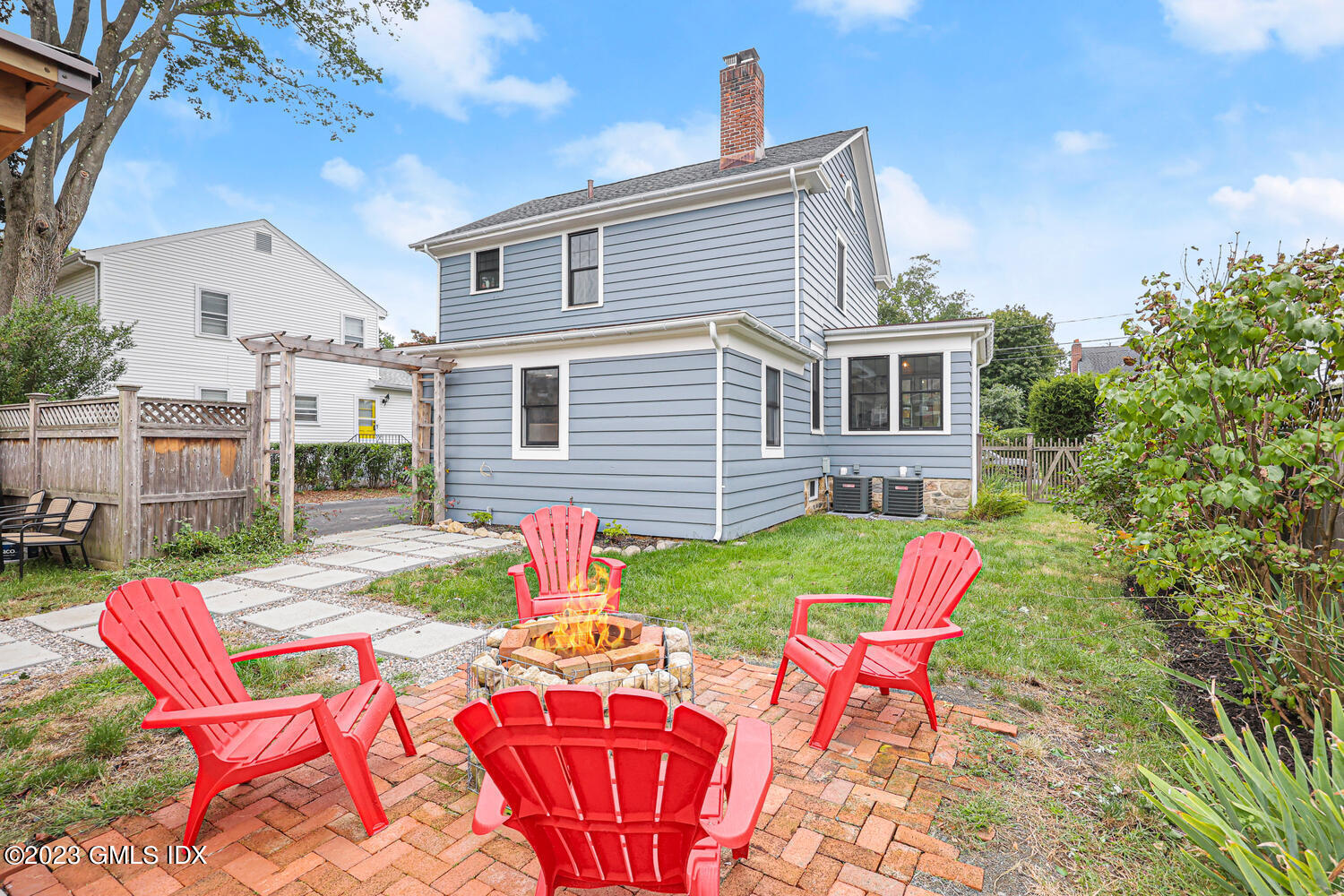 36 Ralph Street Stamford, CT 06902 - Photo 16 of 20 a view of a house with backyard sitting area and garden