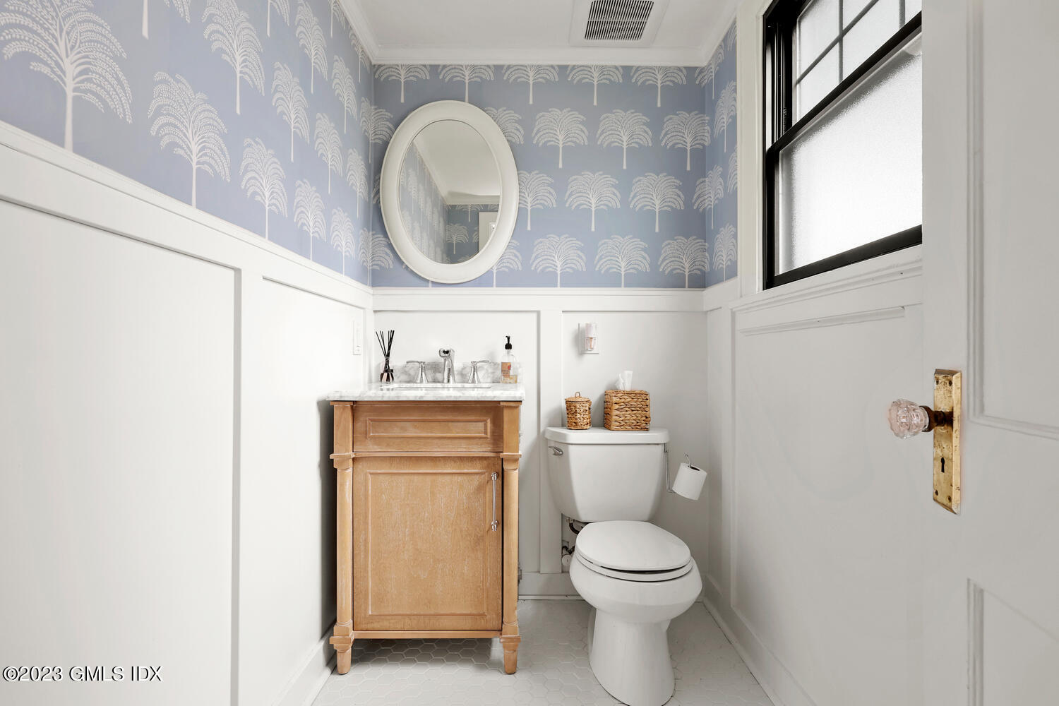 36 Ralph Street Stamford, CT 06902 - Photo 7 of 20 a white toilet sitting next to a bathroom sink