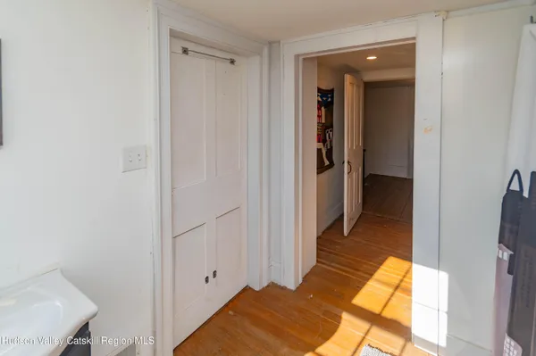 a view of a bathroom from a hallway