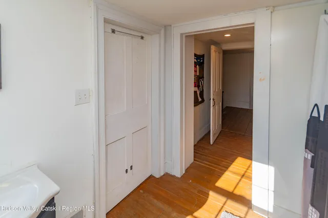 a view of a bathroom from a hallway