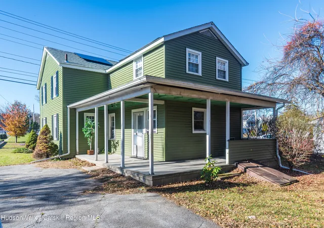 a view of a house with a yard