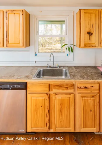 a view of a sink and a window