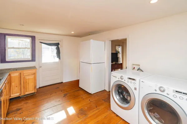 a view of a storage & utility room with washer and dryer