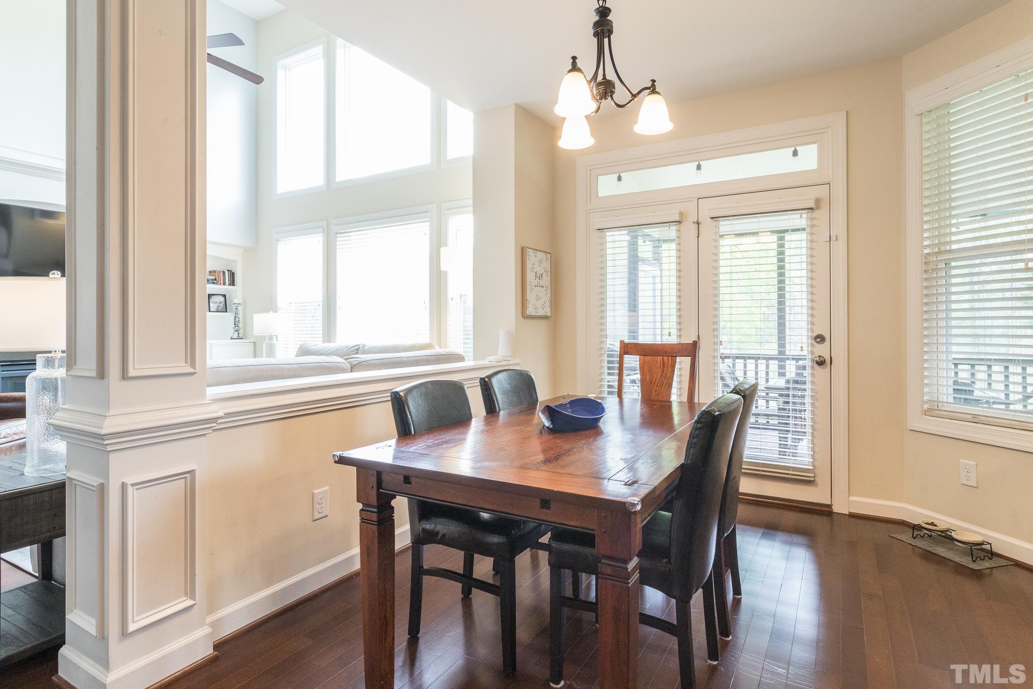 2800 Bending Tree Court Raleigh, NC 27613 - Photo 23 of 49 a view of a a dining room with furniture window and wooden floor