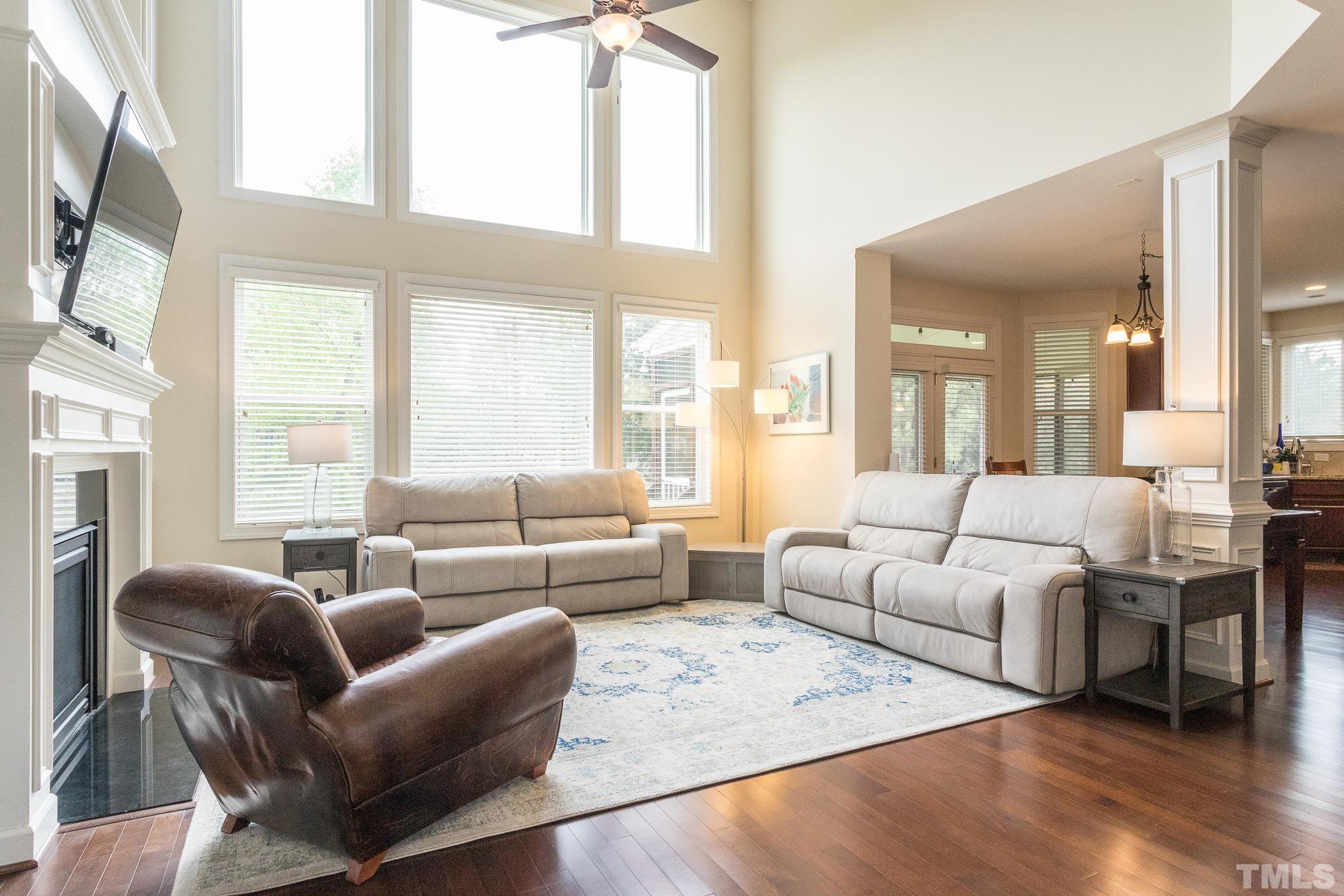 2800 Bending Tree Court Raleigh, NC 27613 - Photo 28 of 49 a living room with furniture wooden floor and a large window