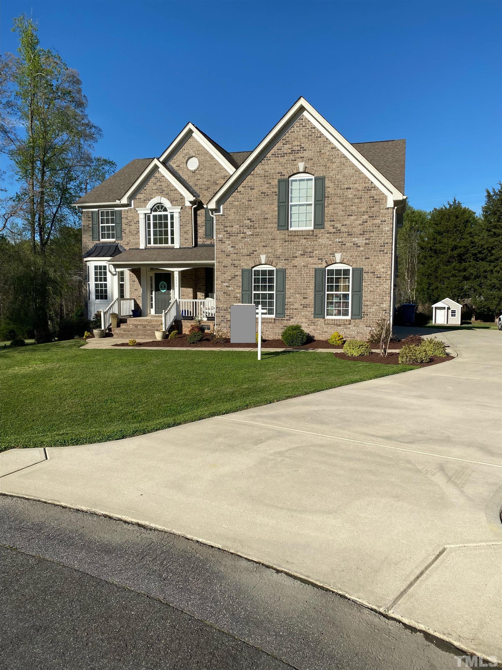 2800 Bending Tree Court Raleigh, NC 27613 - Photo 3 of 49 a front view of a house with a yard