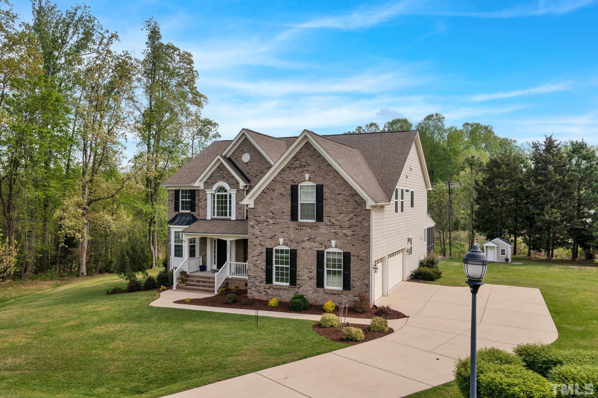 2800 Bending Tree Court Raleigh, NC 27613 - Photo 47 of 49 a front view of a house with garden