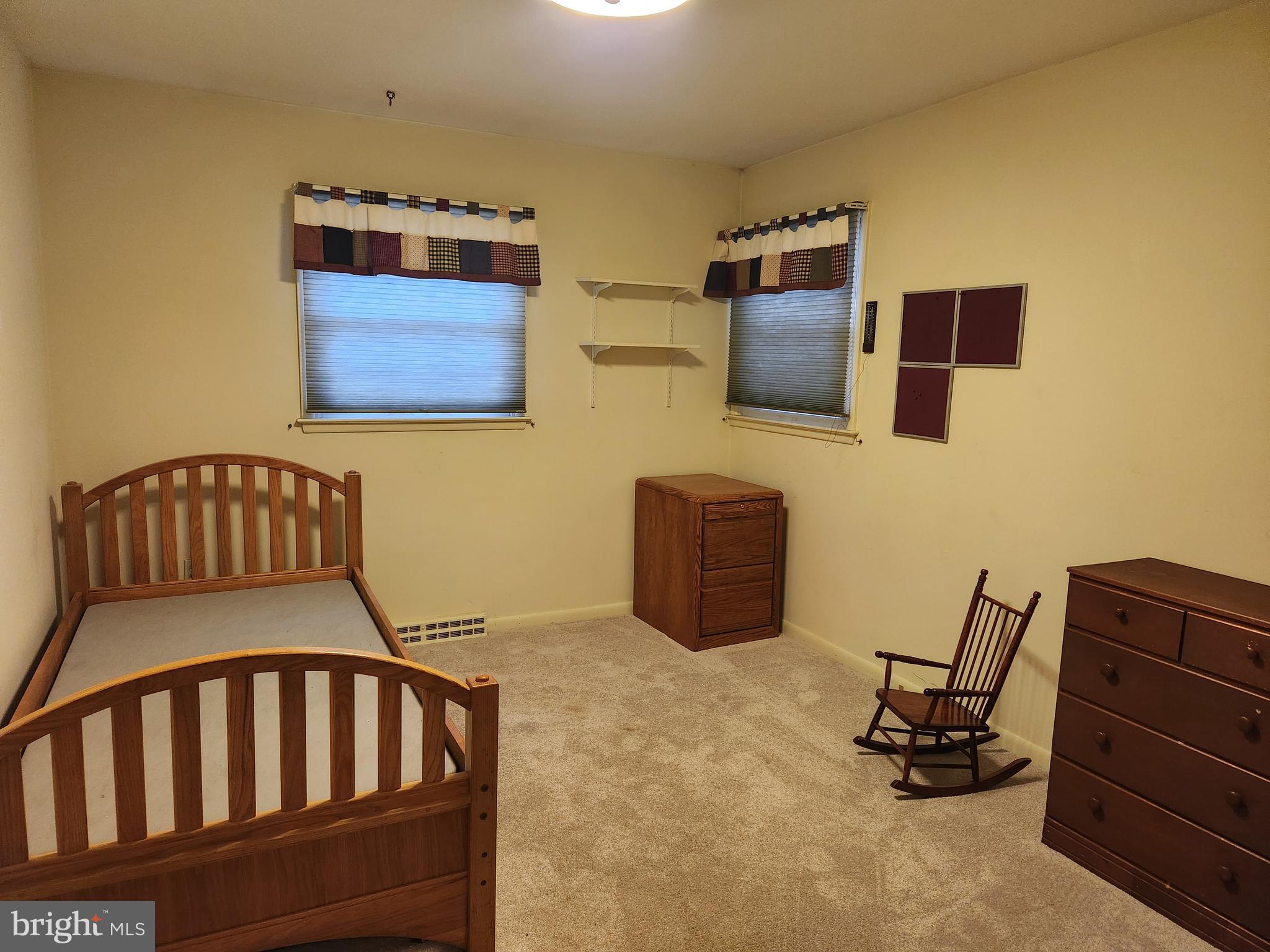 3116 Linda Lane Sinking Spring, PA 19608 - Photo 18 of 44 a bedroom with a bed and wooden floor