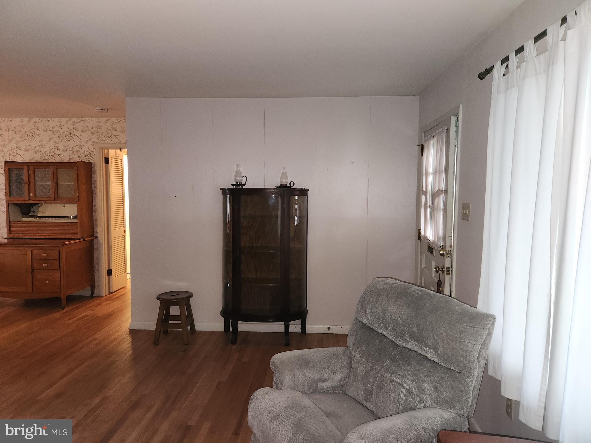 3116 Linda Lane Sinking Spring, PA 19608 - Photo 28 of 44 a living room with furniture and a wooden floor