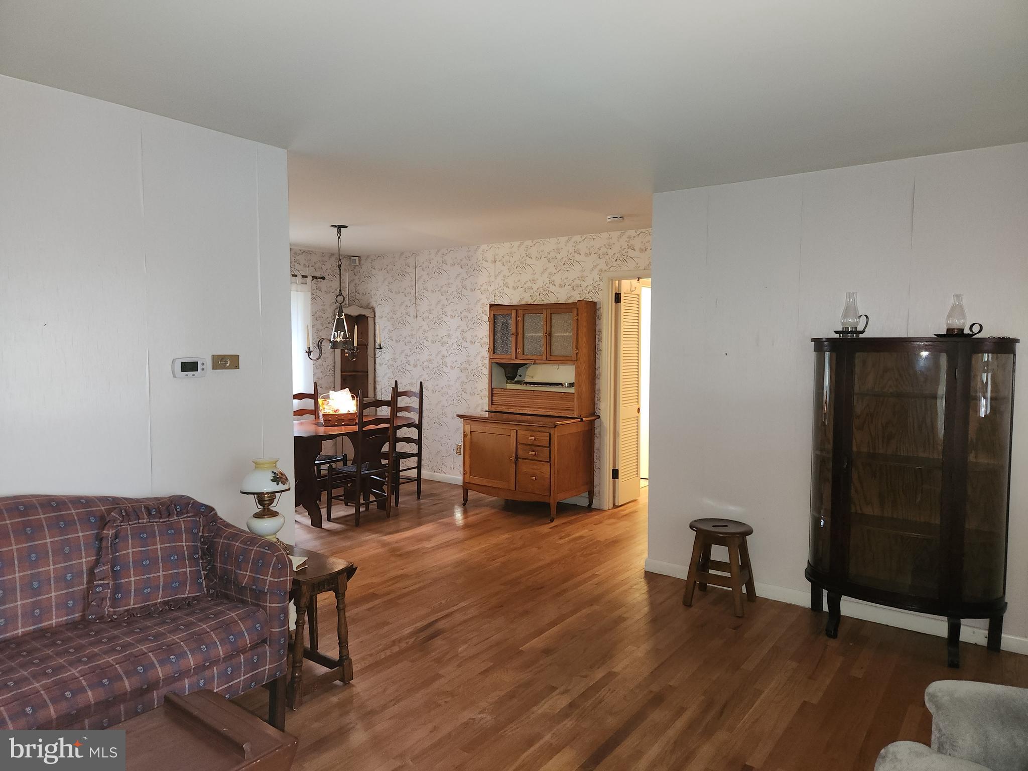 3116 Linda Lane Sinking Spring, PA 19608 - Photo 29 of 44 a living room with furniture and a wooden floor