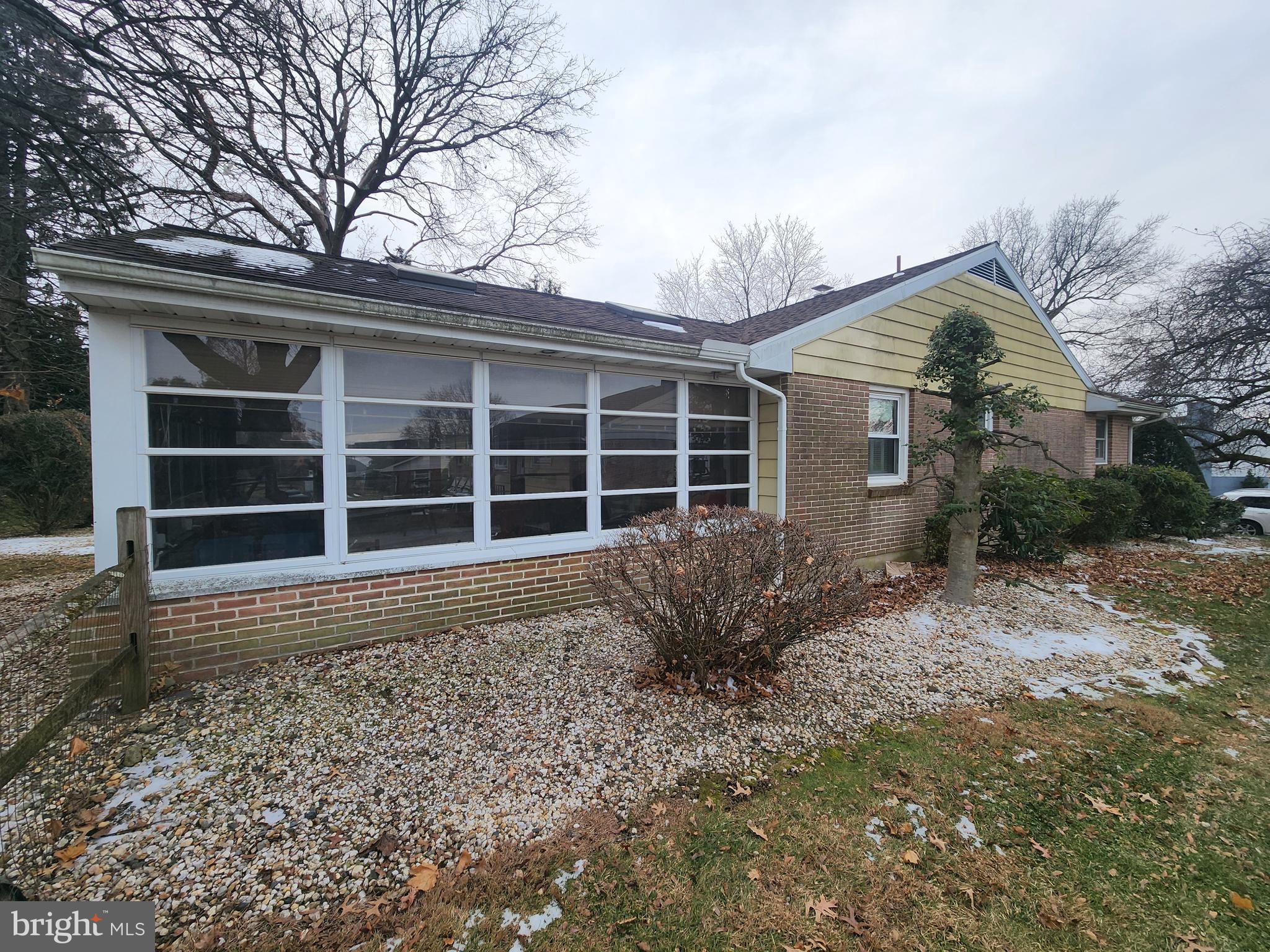 3116 Linda Lane Sinking Spring, PA 19608 - Photo 7 of 44 a front view of a house with a large window and potted plants