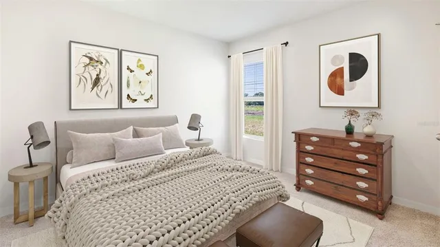 a bedroom with a bed and painting on the wall