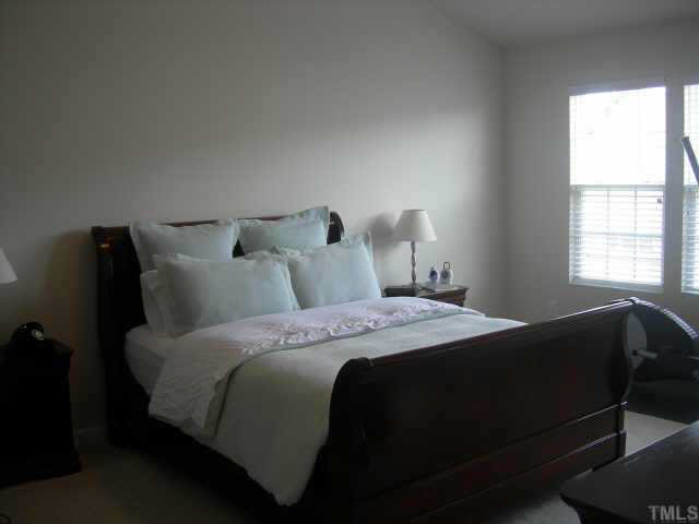 1509 Nealstone Way Raleigh, NC 27614 - Photo 7 of 10 a bedroom with bed and window