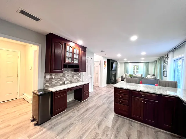 a large kitchen with a stove and a sink
