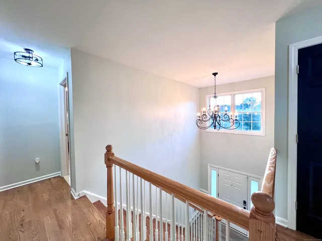 a view of a hallway to a window