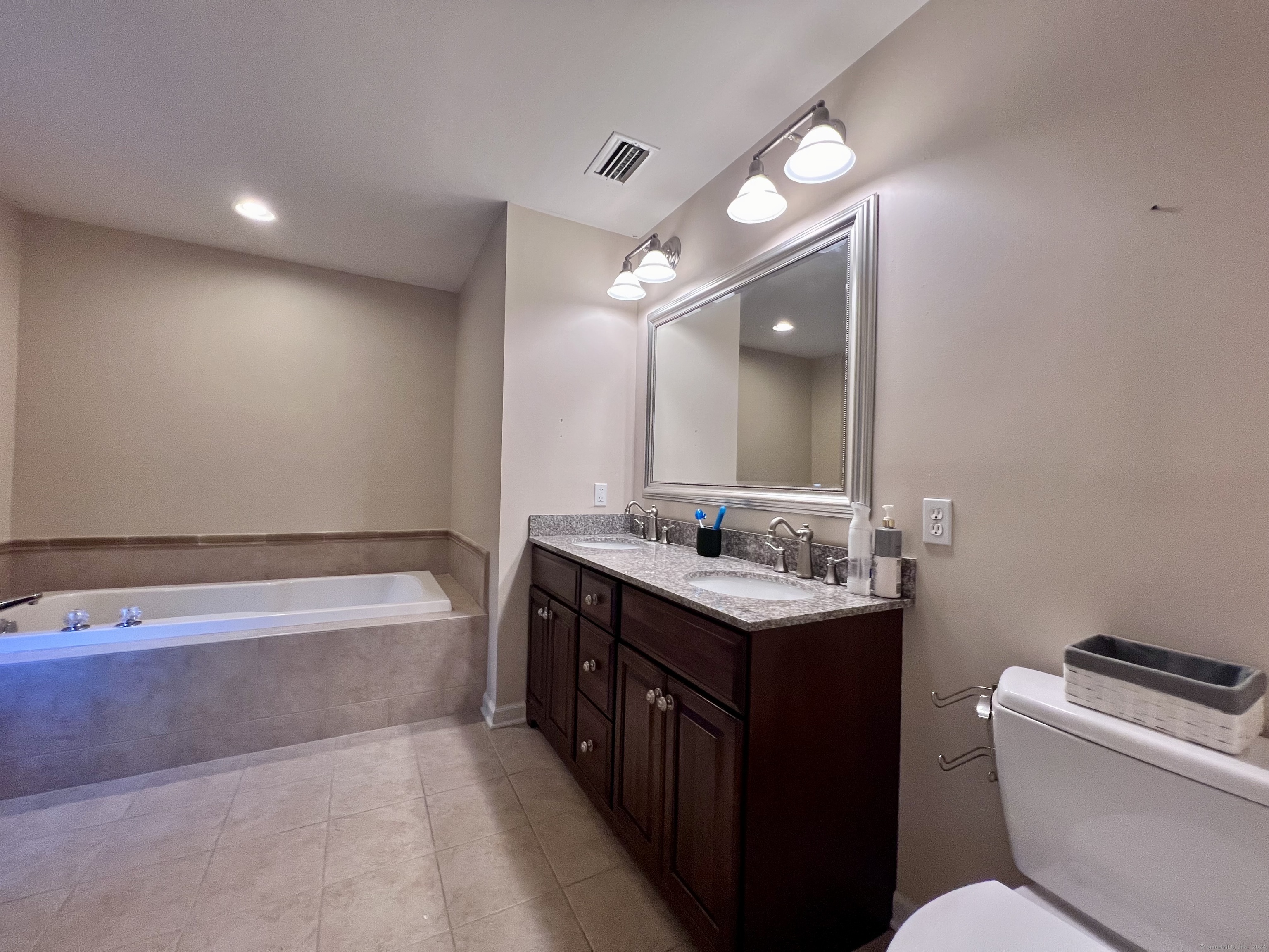 4 Cobblestone Court Naugatuck, CT 06770 - Photo 22 of 34 a bathroom with a tub sink and mirror