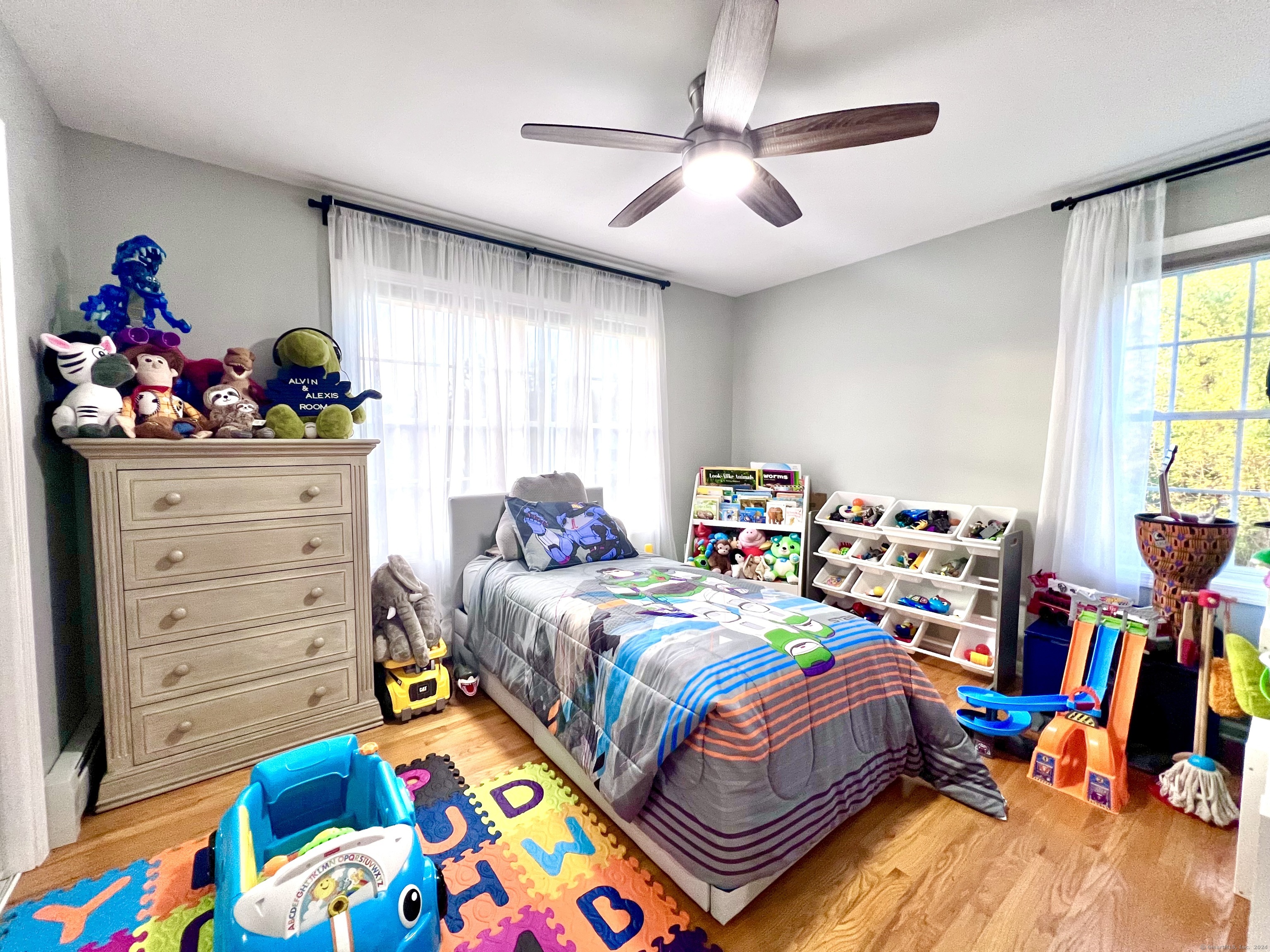 4 Cobblestone Court Naugatuck, CT 06770 - Photo 23 of 34 a bed room with bed and a baby crib